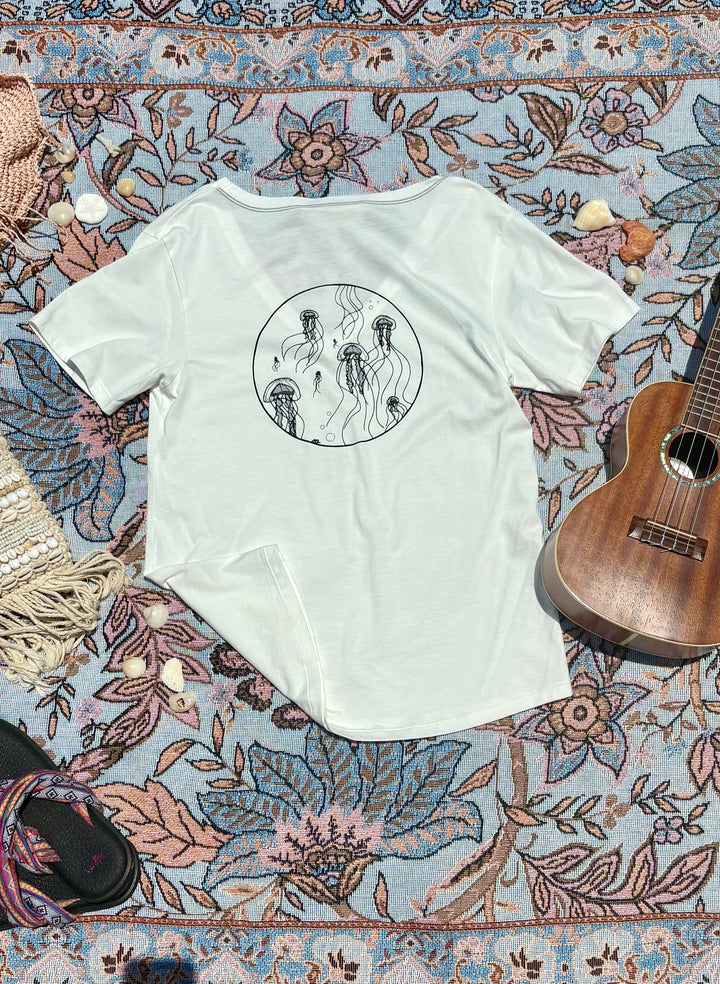white v-neck tee with jellyfish depiction on back.