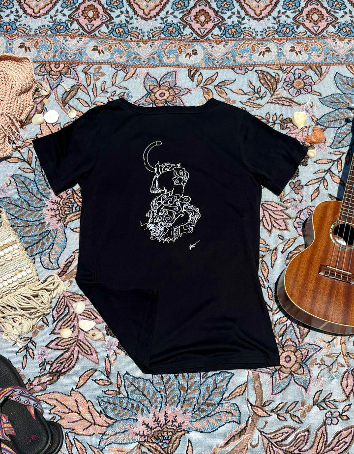 black round-neck tee with intricate lion depiction on back.