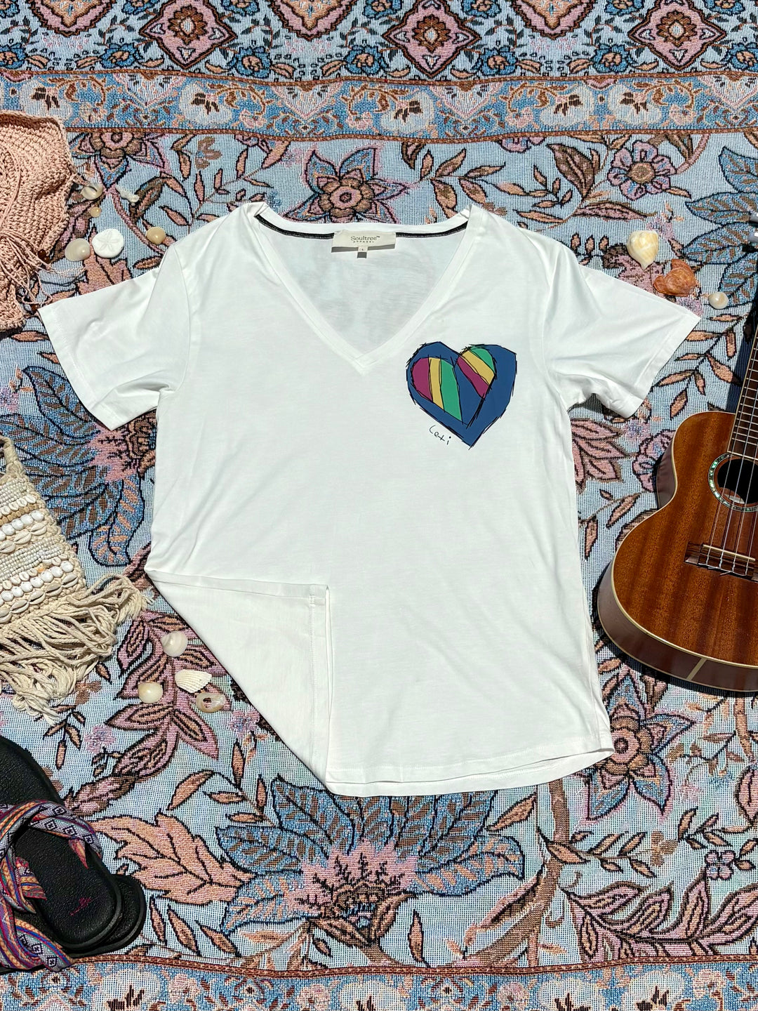 white v-neck tee with colorful heart printed on left chest.