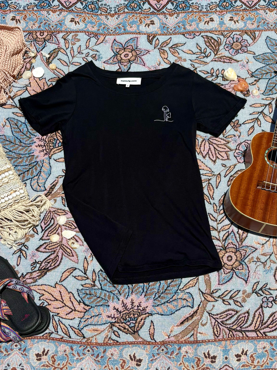 black round-neck tee with mushroom embroidered sketch on left chest.