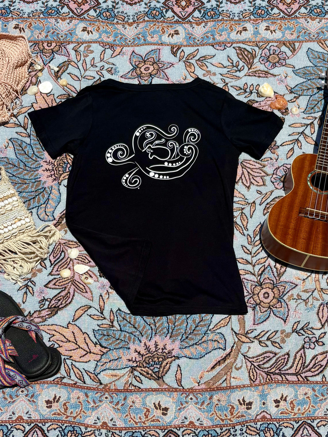 black round-neck tee with octopus sketch on back.