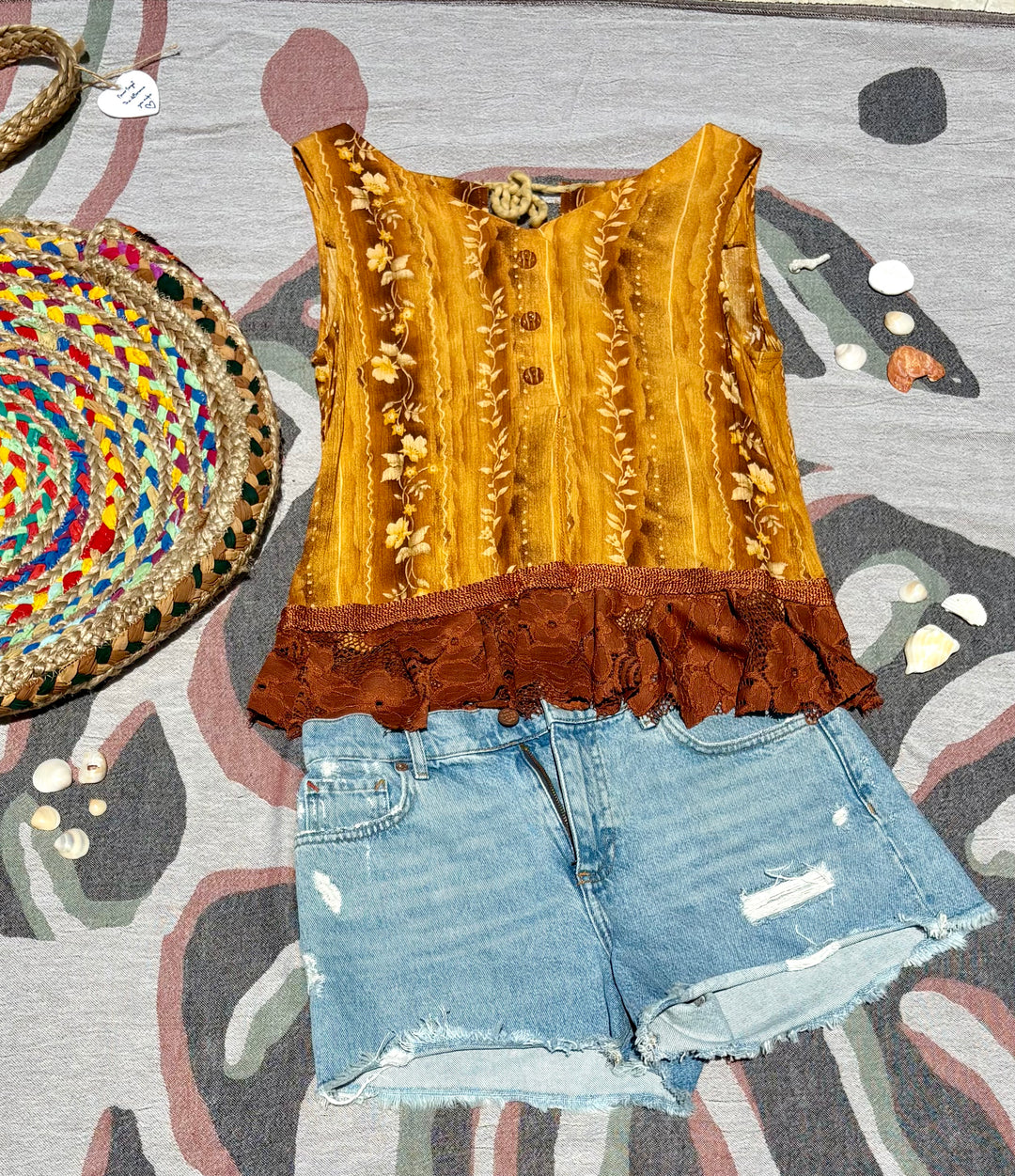 multi-color tank top with lace trim and open back.